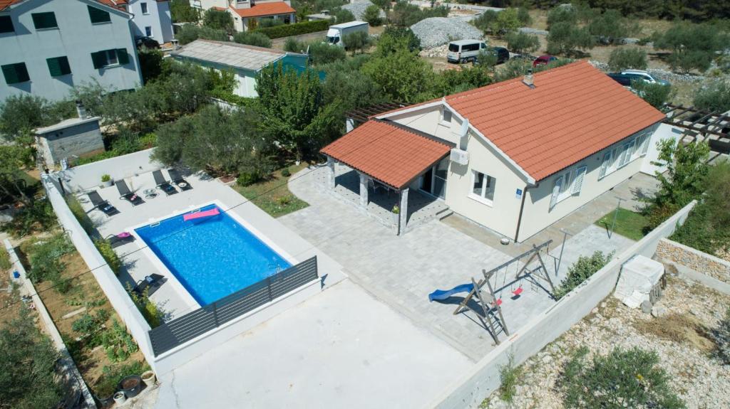 an aerial view of a house with a swimming pool at Villa Divna in Srima