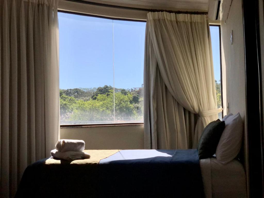 Postel nebo postele na pokoji v ubytování Hotel del Parque