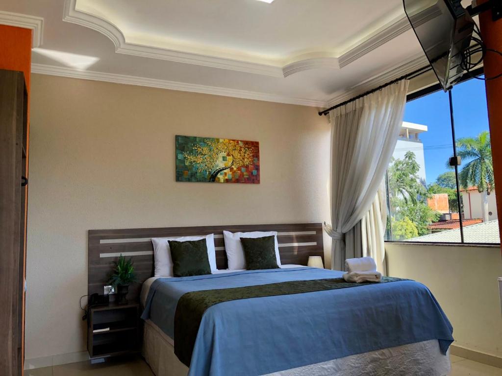 Postel nebo postele na pokoji v ubytování Hotel del Parque