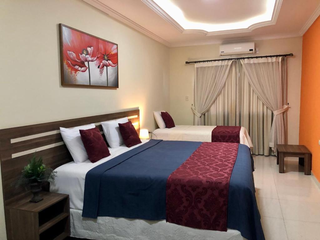 Postel nebo postele na pokoji v ubytování Hotel del Parque