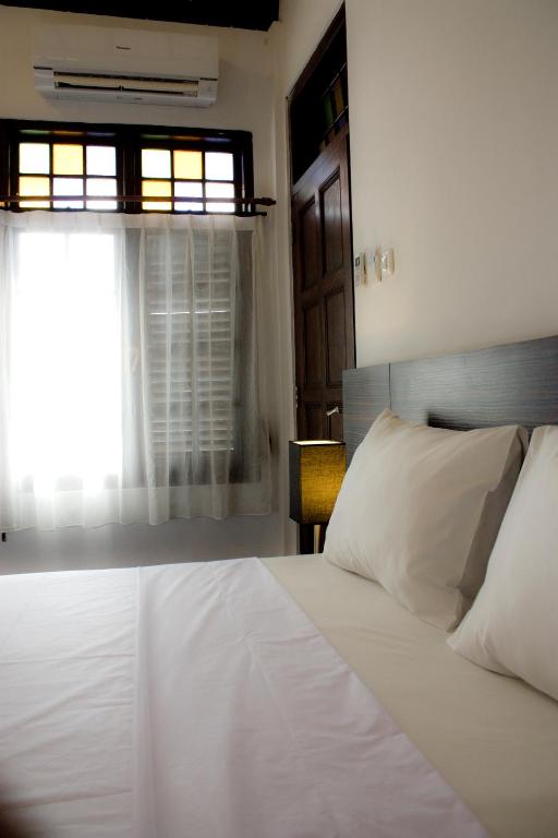 Postel nebo postele na pokoji v ubytování Grand Marto Hotel