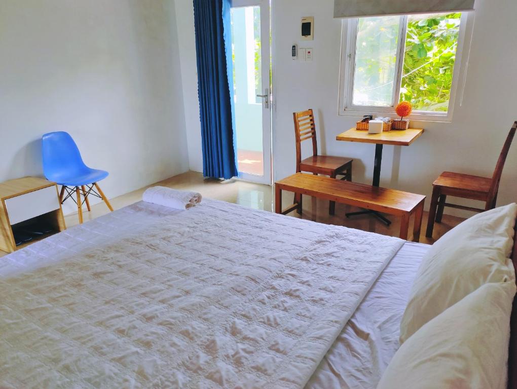 Postel nebo postele na pokoji v ubytování Hoang Sa Beach Healing Home