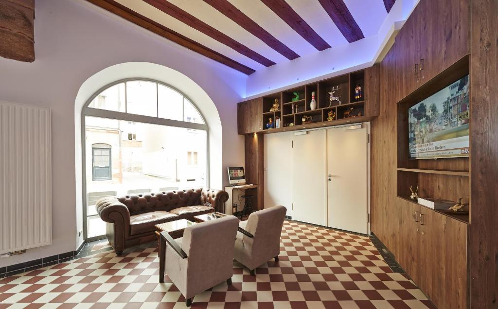TV a/nebo společenská místnost v ubytování Hotel Elch Boutique
