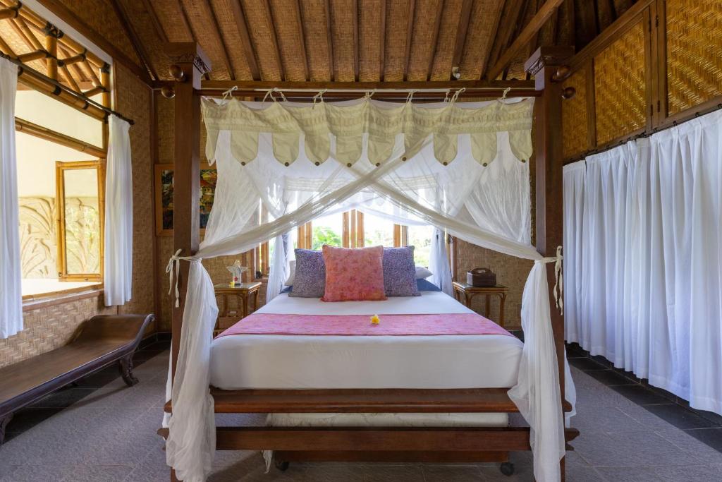Postel nebo postele na pokoji v ubytování Bali Firefly BnB