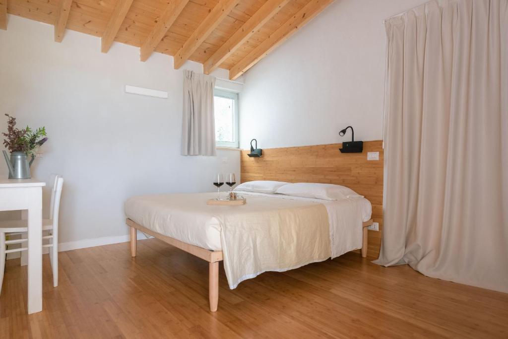 Postel nebo postele na pokoji v ubytování OrtoPì Country Canapa House