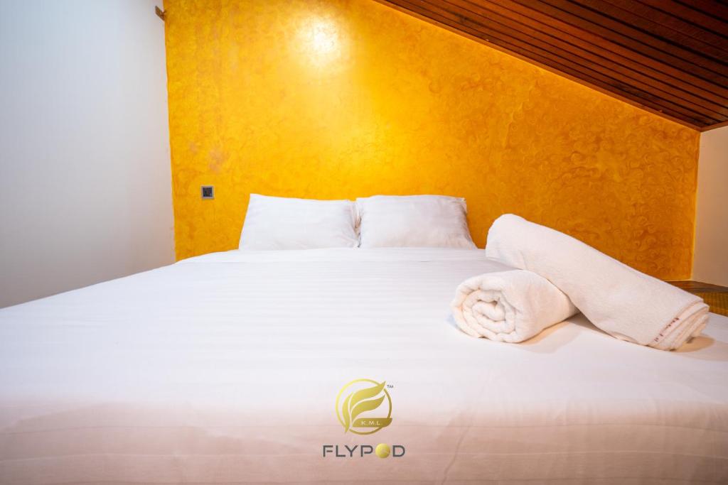Postel nebo postele na pokoji v ubytování Flypod . Kinabalu Mt Lodge