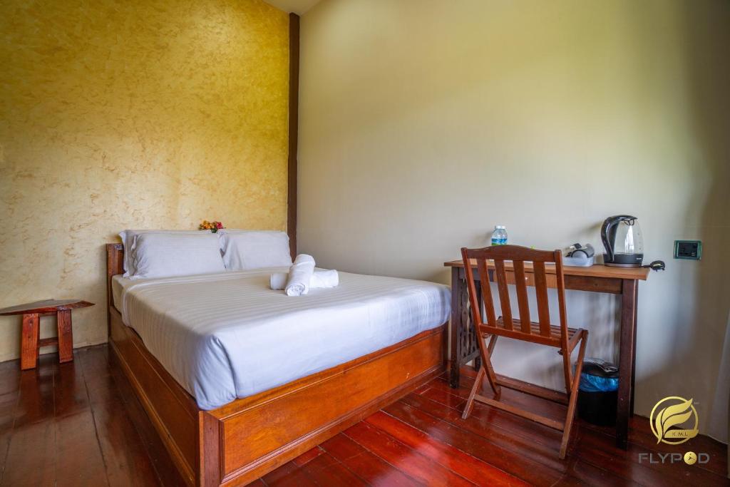 Postel nebo postele na pokoji v ubytování Flypod . Kinabalu Mt Lodge