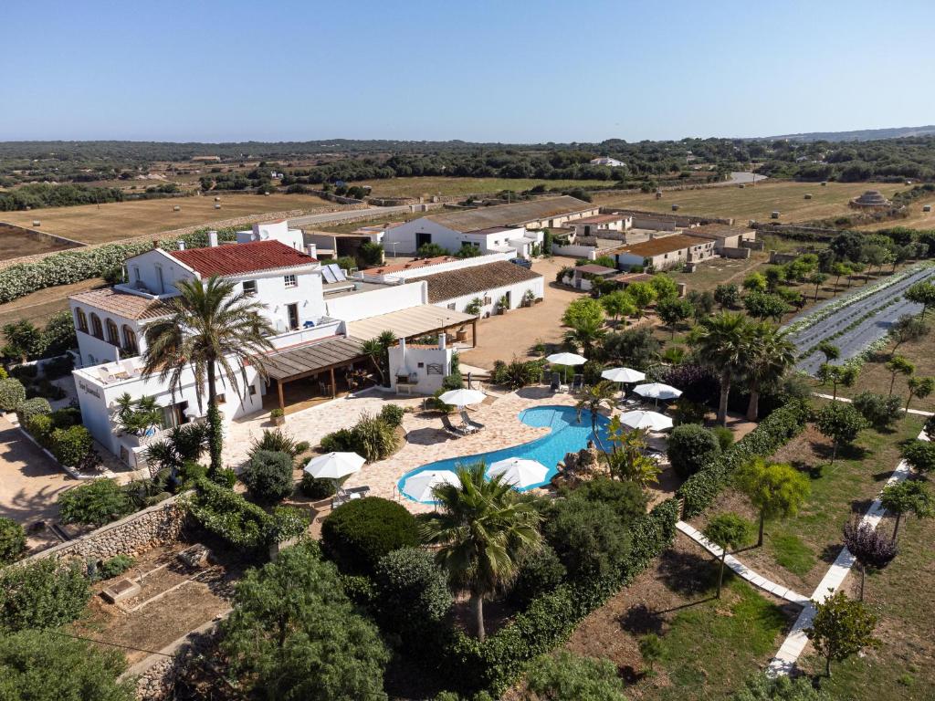 an aerial view of a resort with a swimming pool at Agroturismo Son Juaneda in Ciutadella