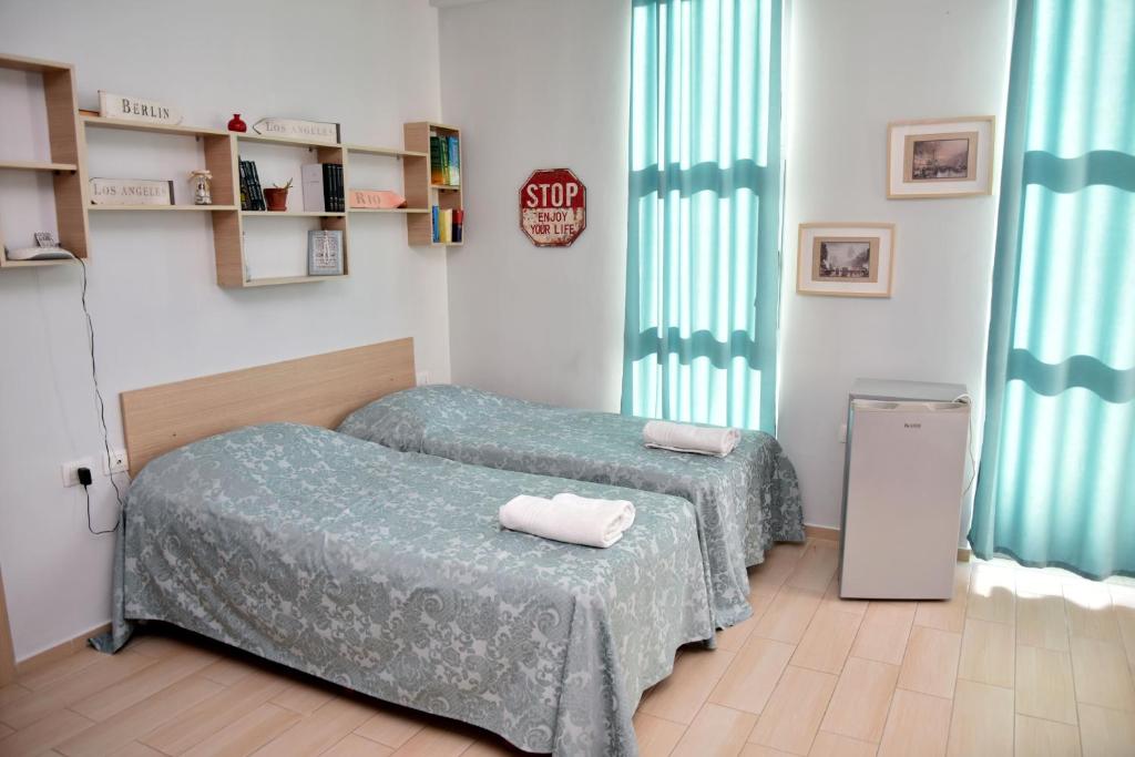 Postel nebo postele na pokoji v ubytování Arianiti Guesthouse