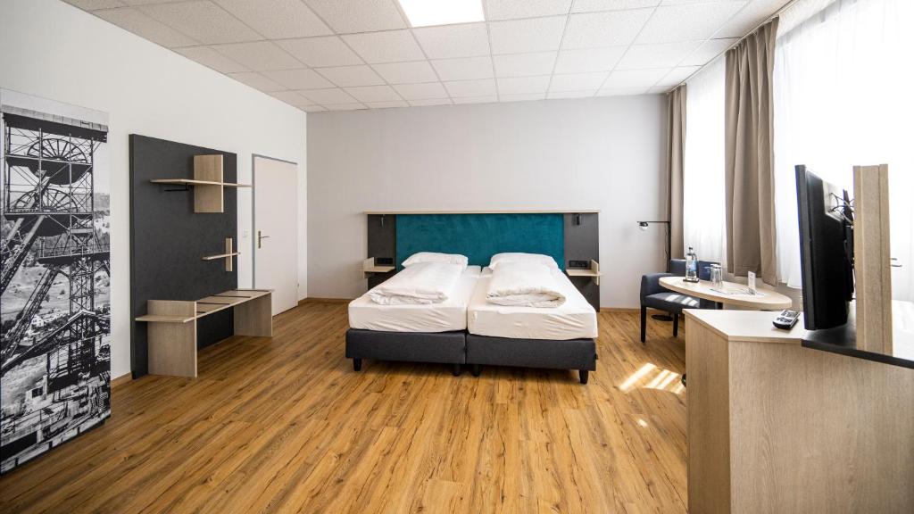 Postel nebo postele na pokoji v ubytování Hotel Fohnsdorf