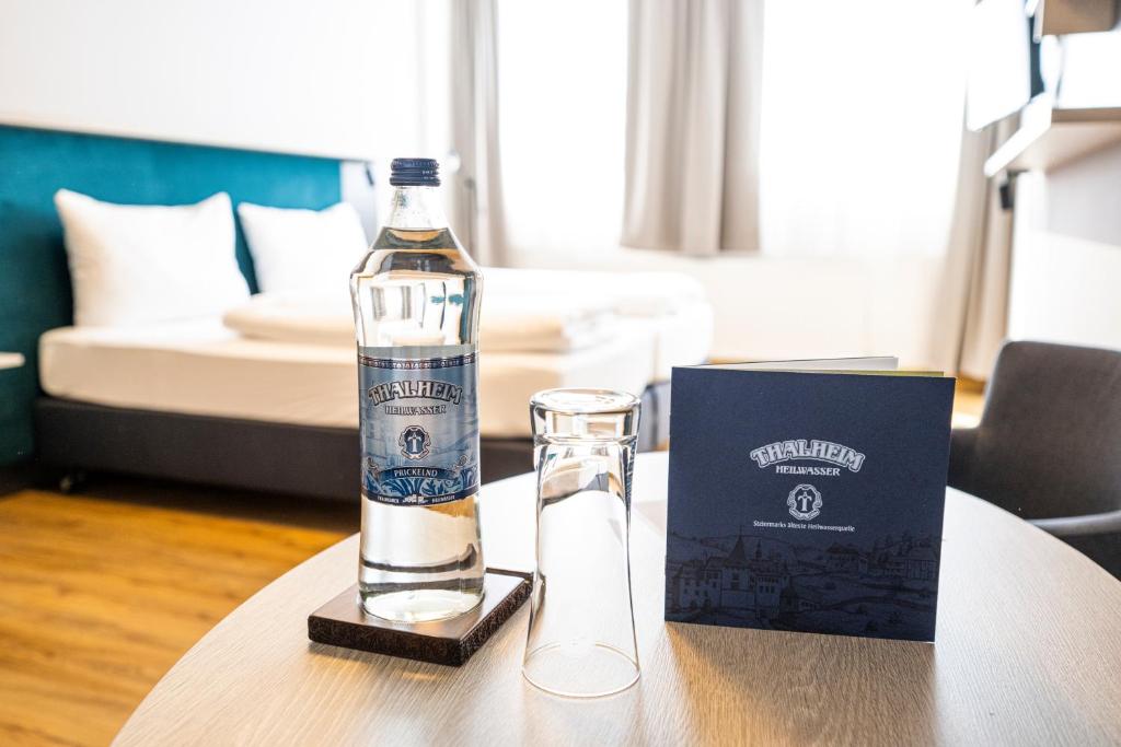 Postel nebo postele na pokoji v ubytování Hotel Fohnsdorf