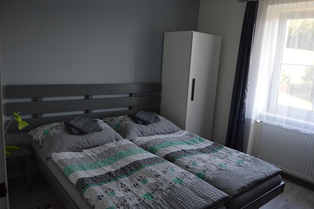 Postel nebo postele na pokoji v ubytování Penzion Kamejk