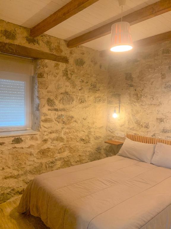 Posteľ alebo postele v izbe v ubytovaní Apartamento Las Medulas