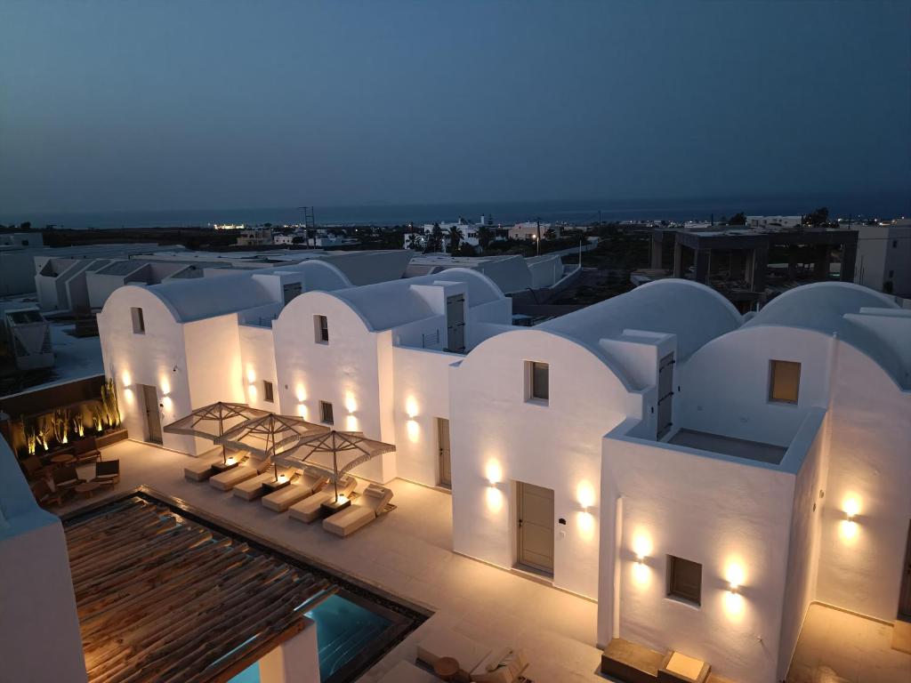an aerial view of a building at night at AVAL All Suite Hotel in Mesaria