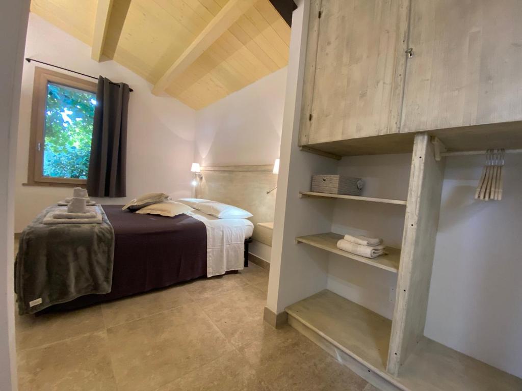A bed or beds in a room at Fattoria dei Cavalieri
