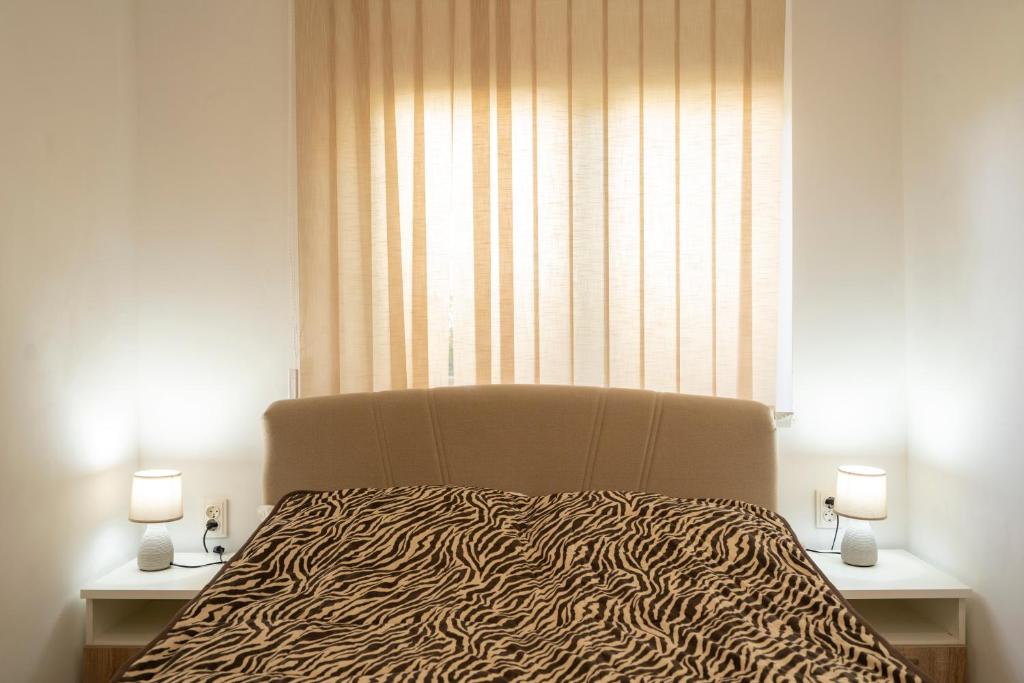 Postel nebo postele na pokoji v ubytování Apartman Čurčić