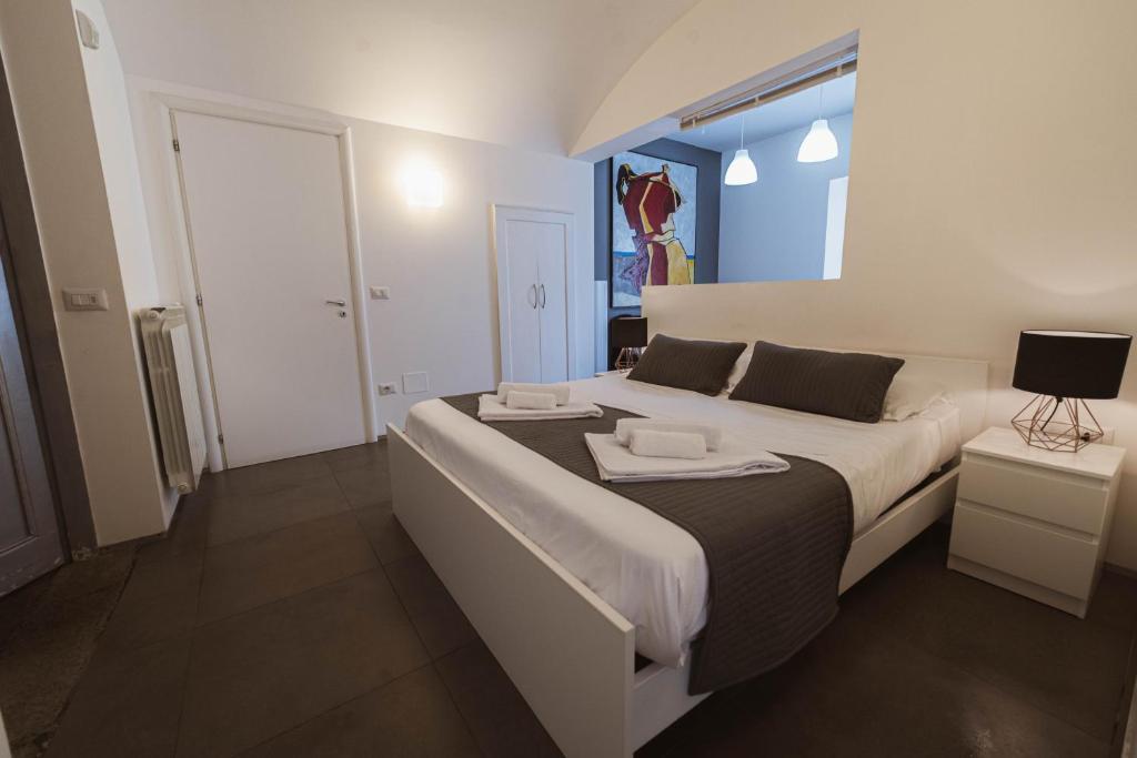Łóżko lub łóżka w pokoju w obiekcie Villino Erminia - Seaside Art b&b