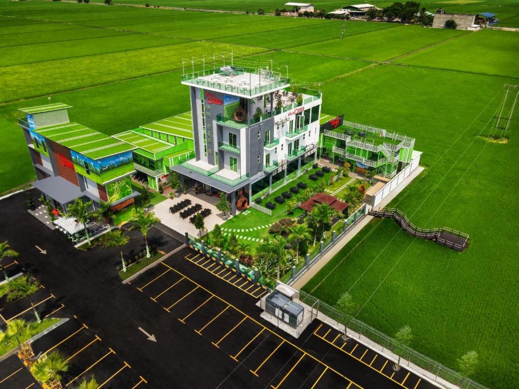 an aerial view of a building in a field at Villa Chee in Sekincan