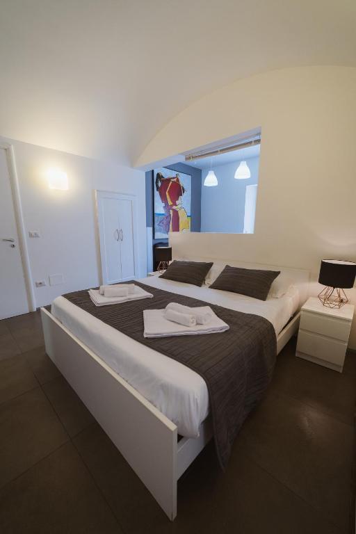 Łóżko lub łóżka w pokoju w obiekcie Villino Erminia - Seaside Art b&b