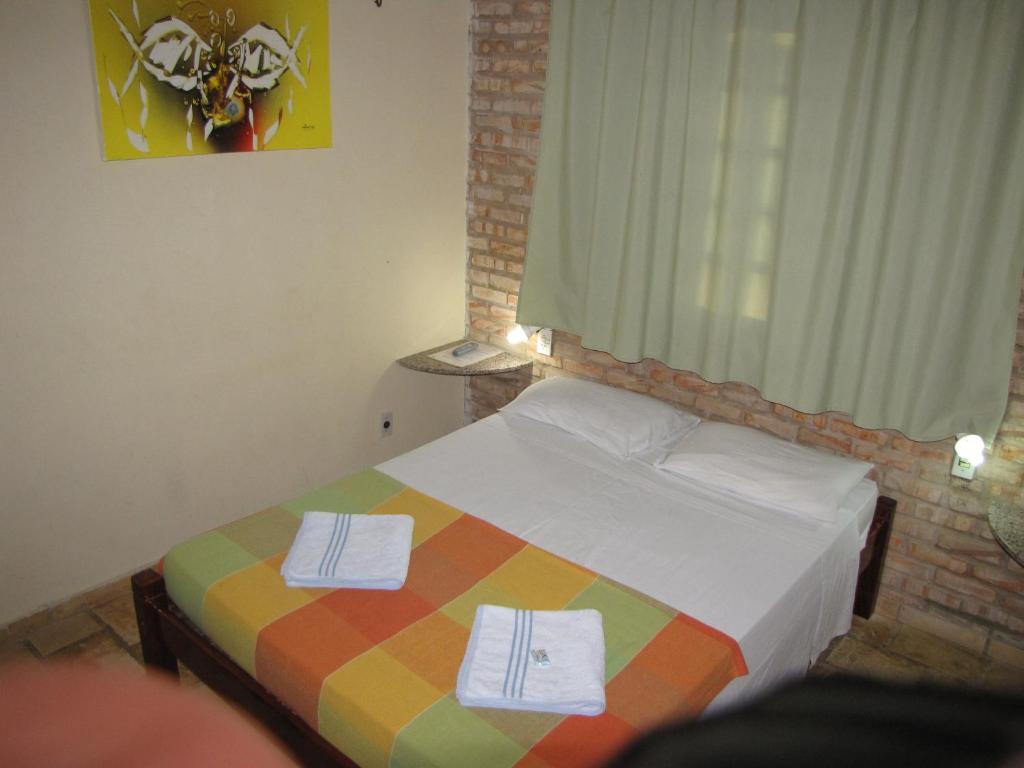 Uma cama ou camas num quarto em Pousada 7 Mares
