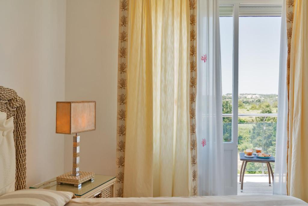 Postel nebo postele na pokoji v ubytování Relais Valle Dell'Idro