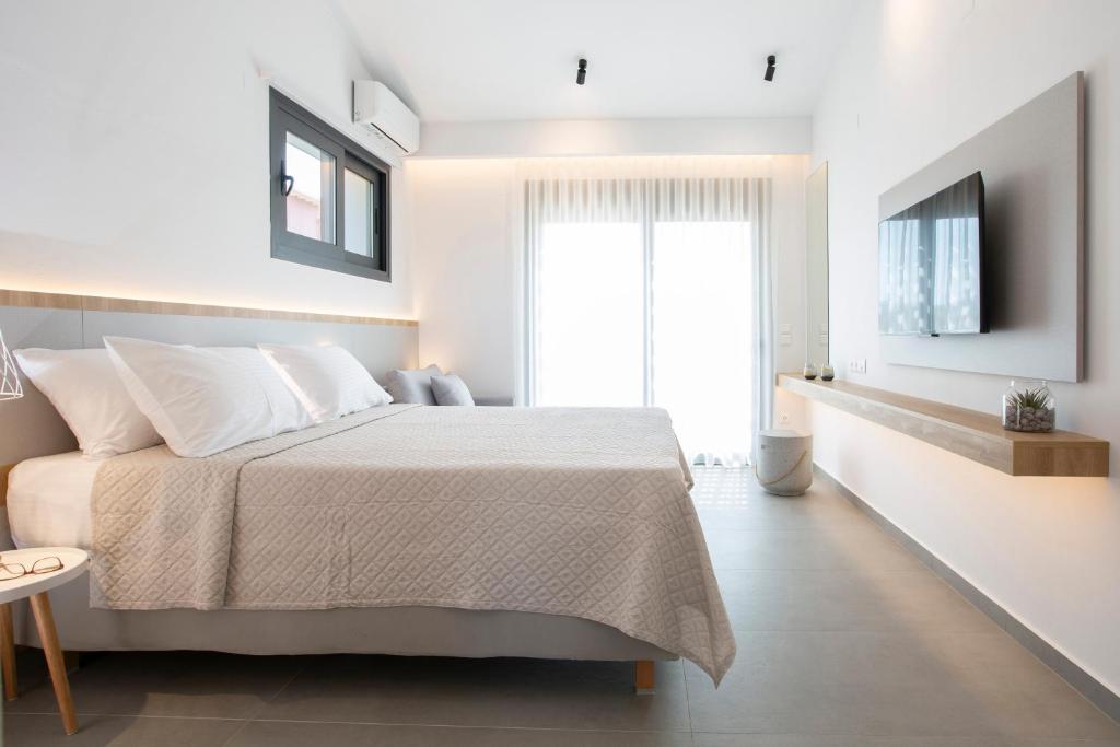 Postel nebo postele na pokoji v ubytování Elianthi Luxury Apartments