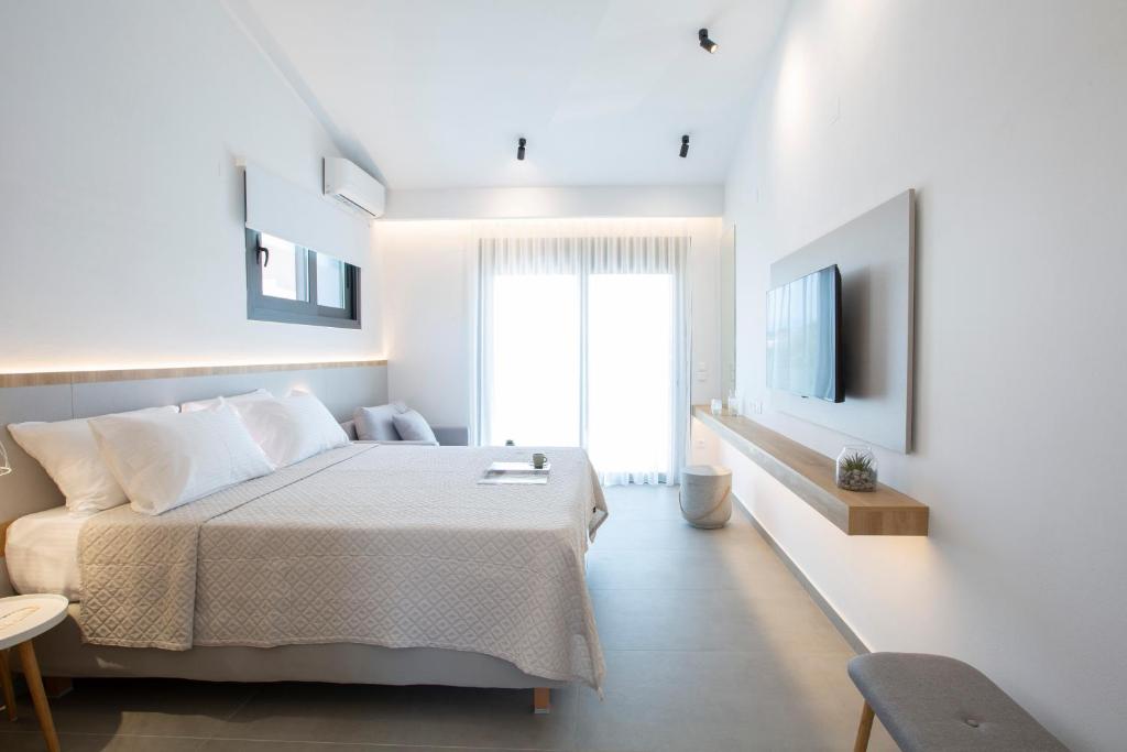 Postel nebo postele na pokoji v ubytování Elianthi Luxury Apartments