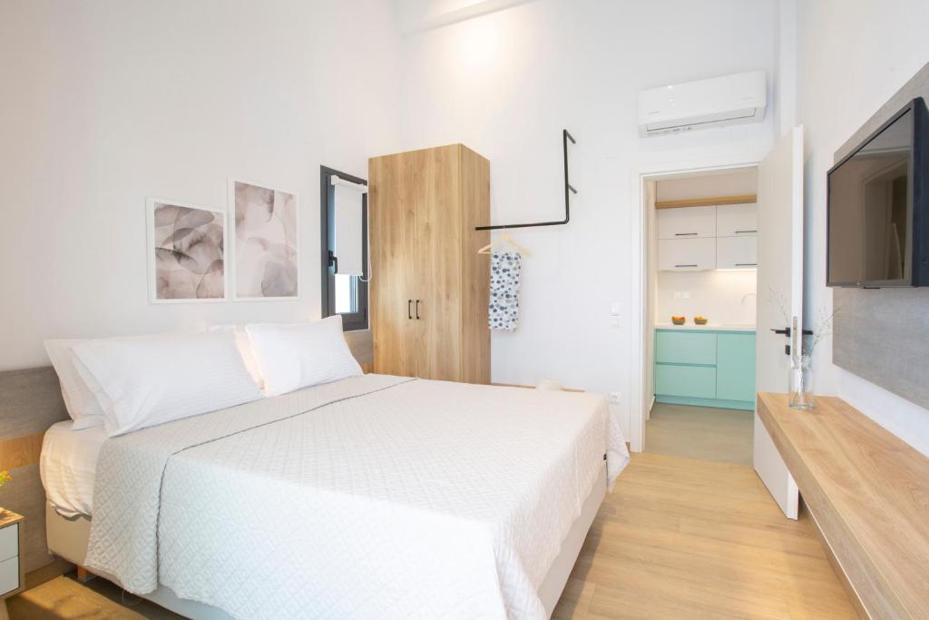 Postel nebo postele na pokoji v ubytování Elianthi Luxury Apartments