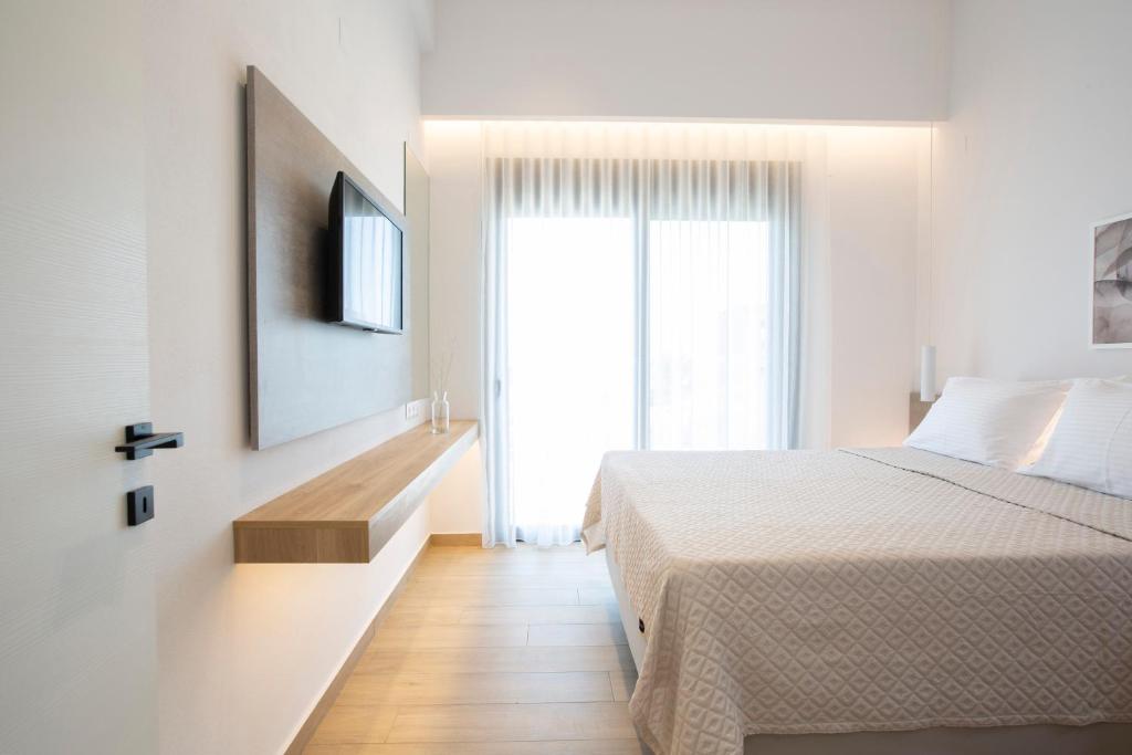 Postel nebo postele na pokoji v ubytování Elianthi Luxury Apartments