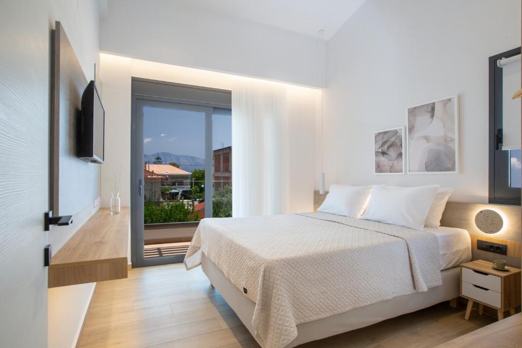 Postel nebo postele na pokoji v ubytování Elianthi Luxury Apartments