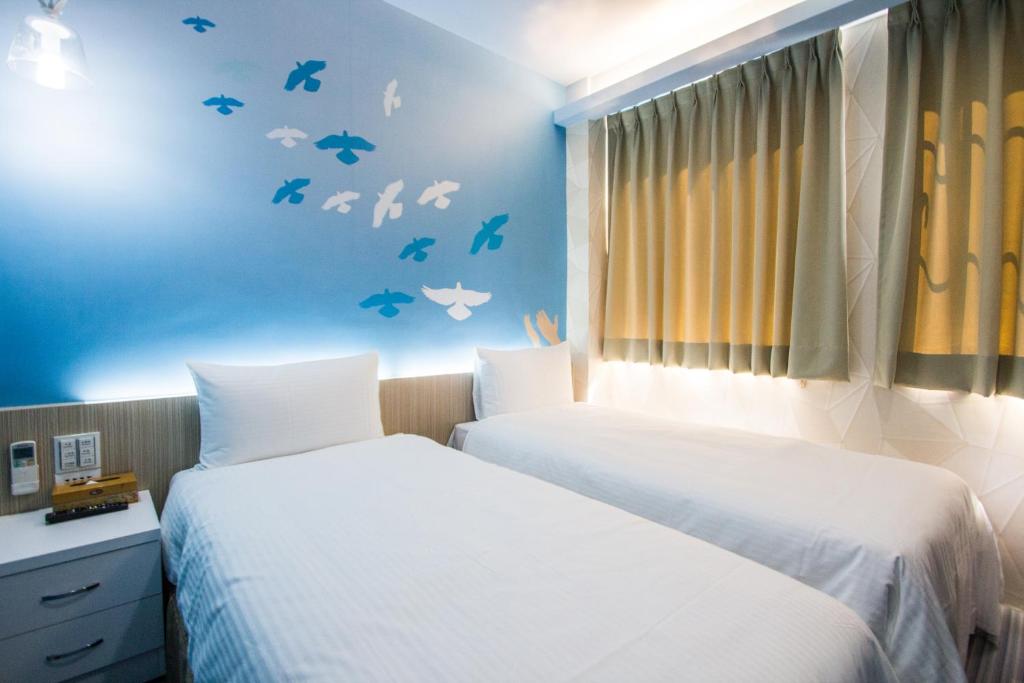 Postel nebo postele na pokoji v ubytování Morwing Hotel - Ocean