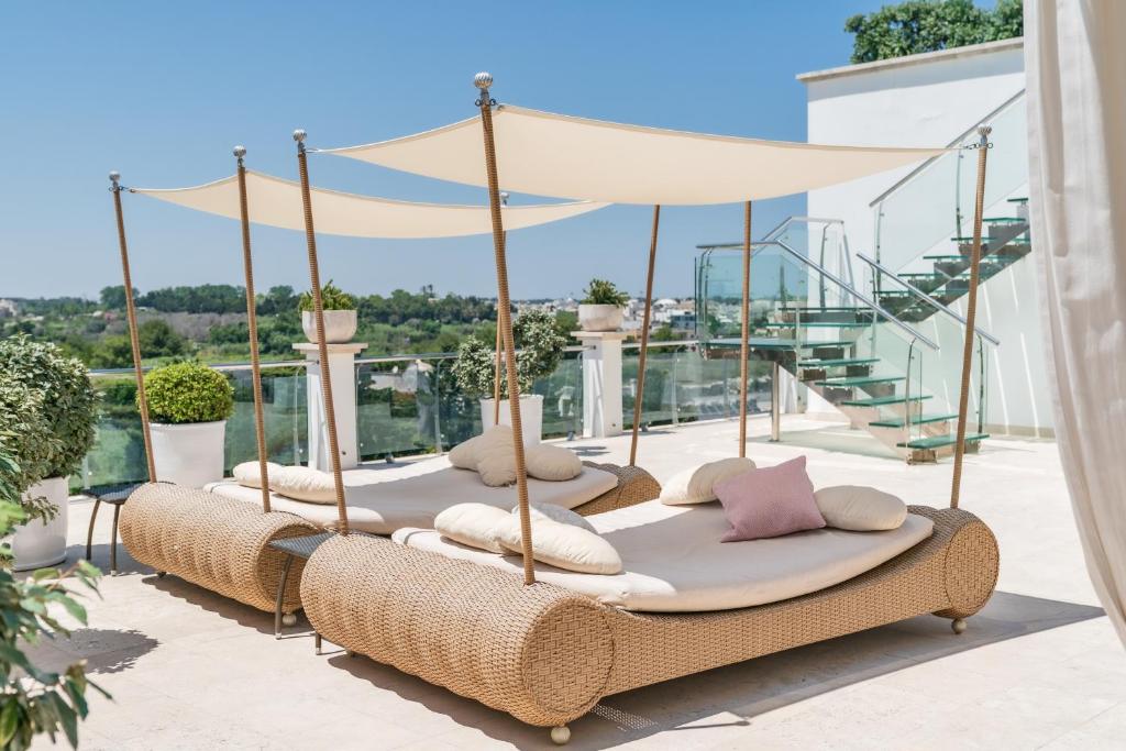 a group of beds sitting on top of a roof at Relais Valle Dell'Idro in Otranto