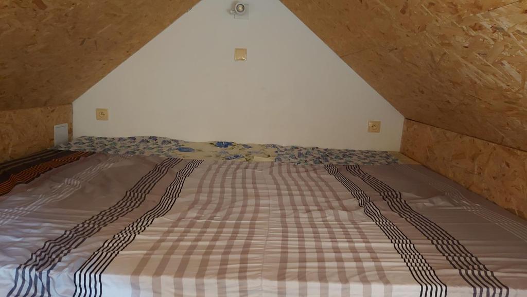 Postel nebo postele na pokoji v ubytování Kubátovna