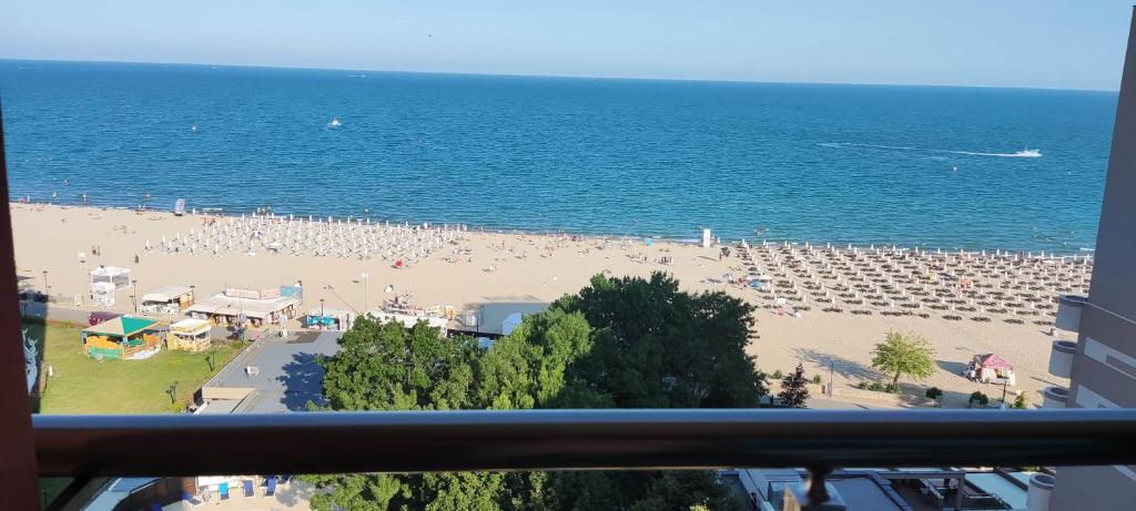 a view of a beach with a lot of people at Hotel Shipka Beach in Sunny Beach
