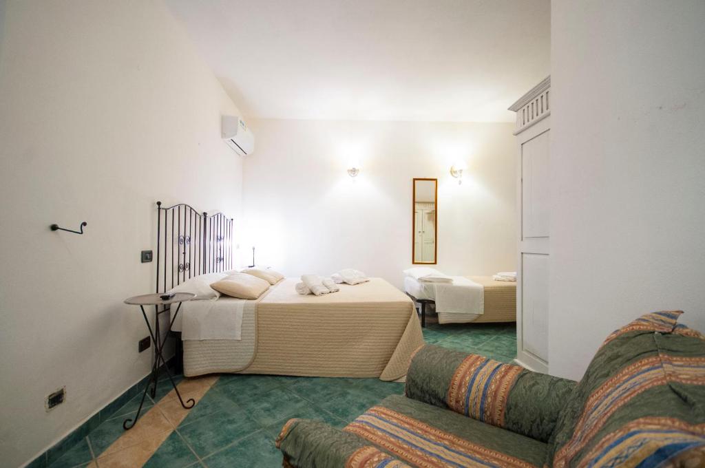 Postel nebo postele na pokoji v ubytování Albergo La Fontanella