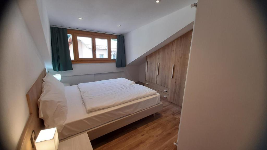 Postel nebo postele na pokoji v ubytování casa vacanze arcobaleno