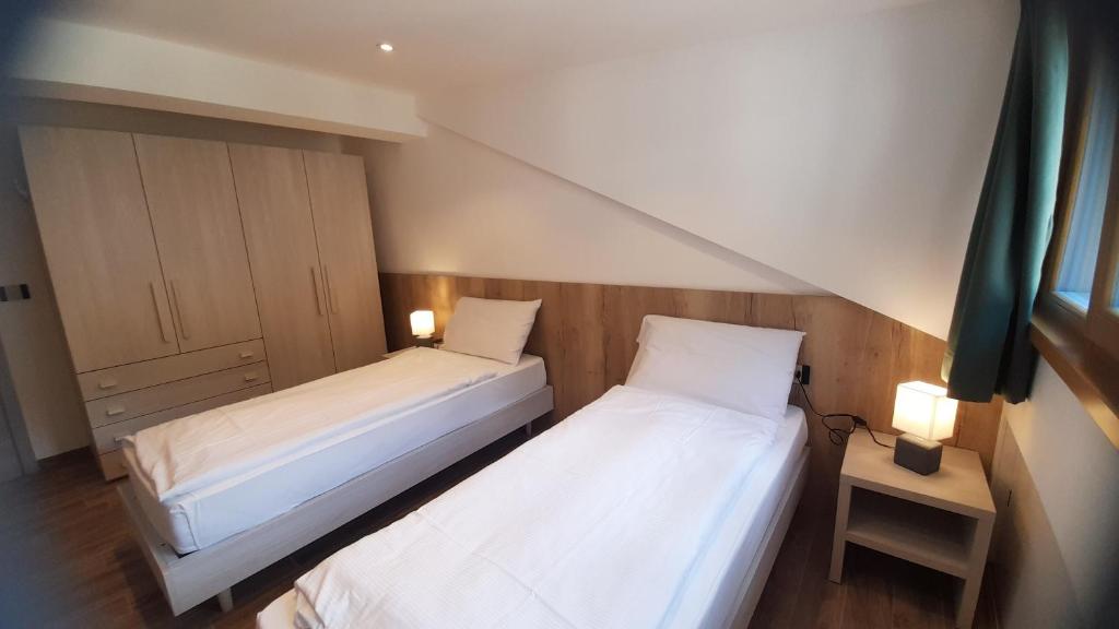 Postel nebo postele na pokoji v ubytování casa vacanze arcobaleno