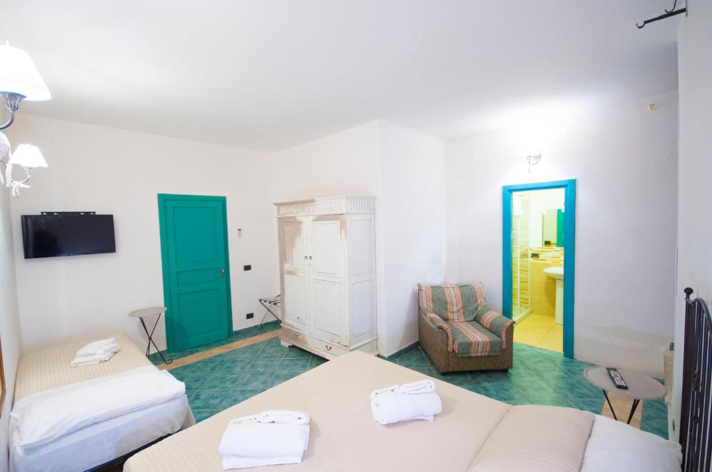 Postel nebo postele na pokoji v ubytování Albergo La Fontanella