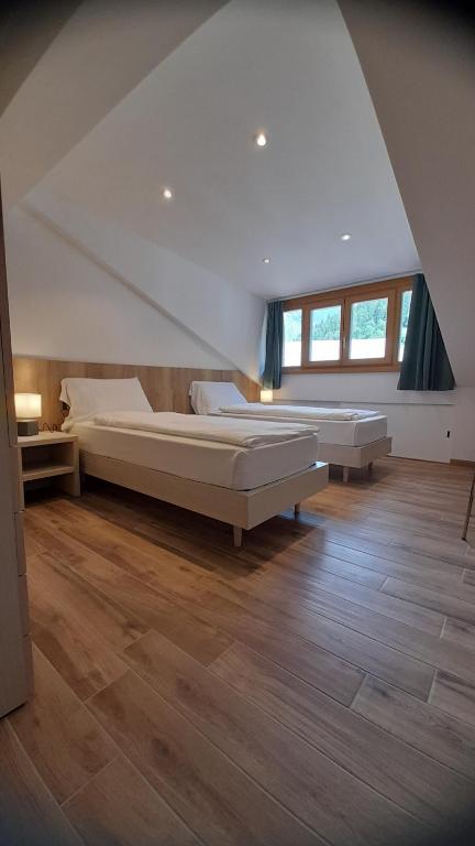 Postel nebo postele na pokoji v ubytování casa vacanze arcobaleno