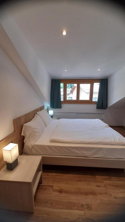 Postel nebo postele na pokoji v ubytování casa vacanze arcobaleno