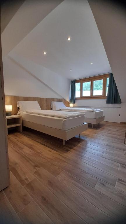 Postel nebo postele na pokoji v ubytování casa vacanze arcobaleno