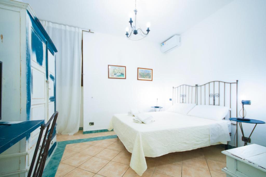 Postel nebo postele na pokoji v ubytování Albergo La Fontanella