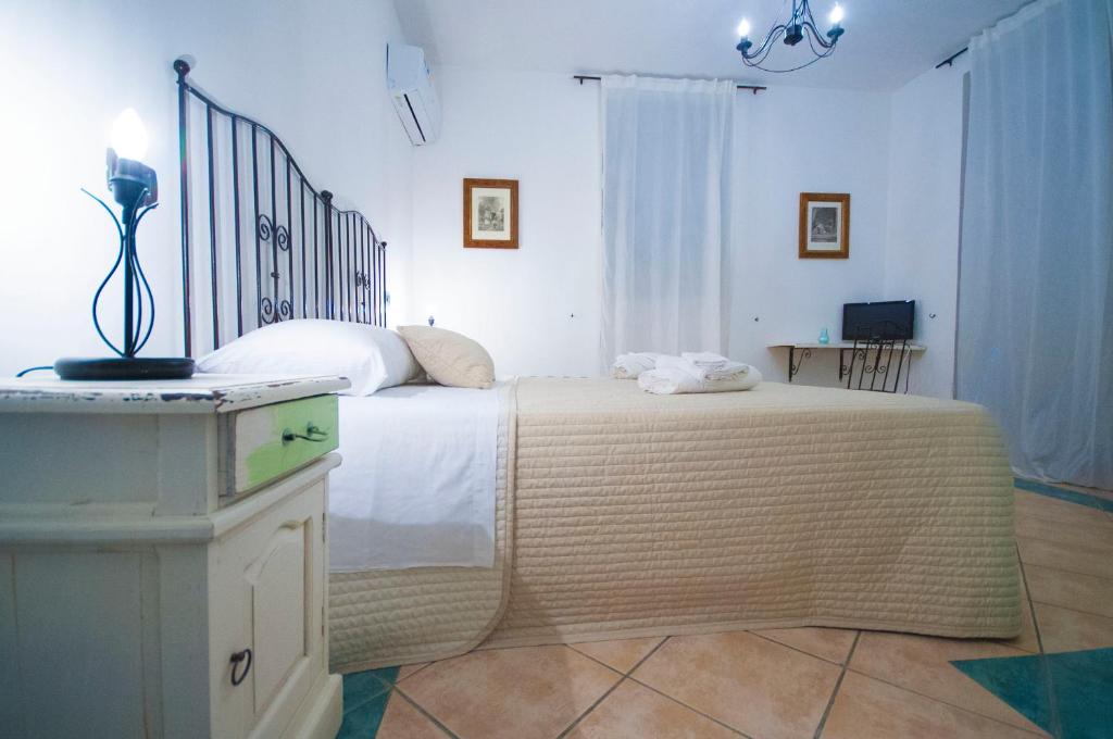 Postel nebo postele na pokoji v ubytování Albergo La Fontanella