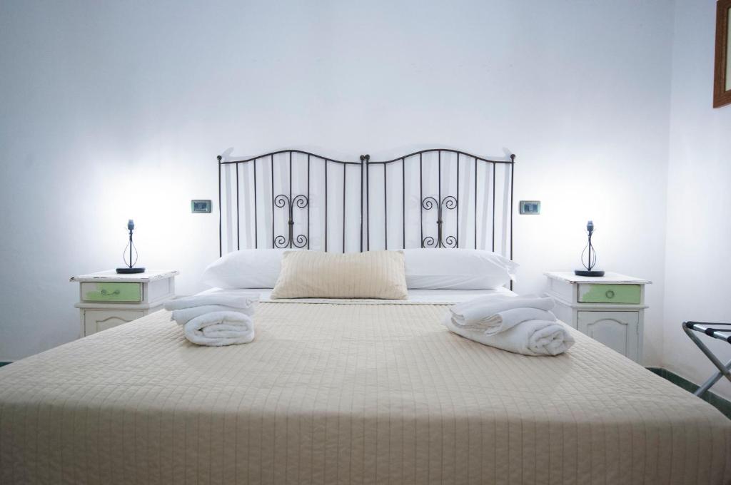 Postel nebo postele na pokoji v ubytování Albergo La Fontanella
