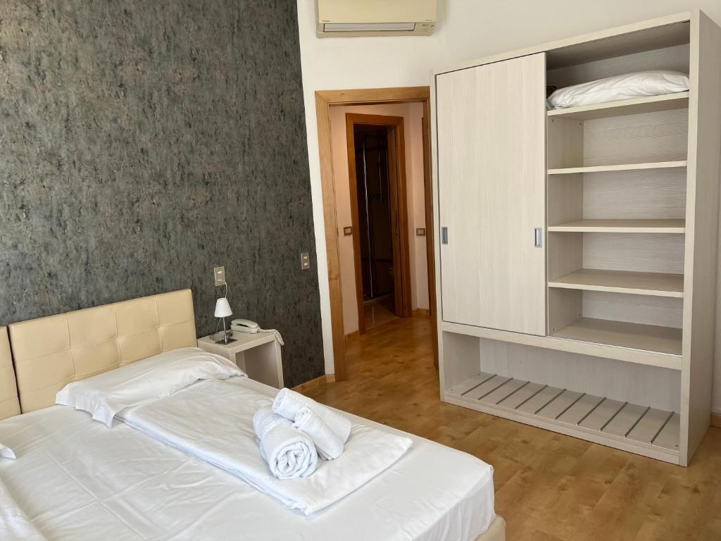 Postel nebo postele na pokoji v ubytování Albergo San Remo