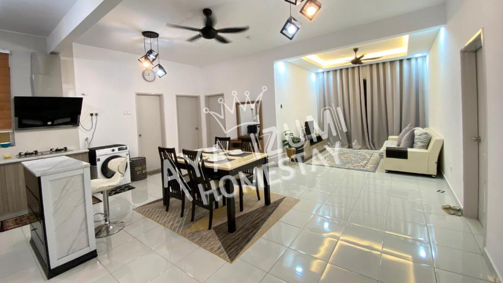 a kitchen and living room with a table and chairs at Aya Izumi 3 bed Condo near to Bangi Wonderland in Kajang