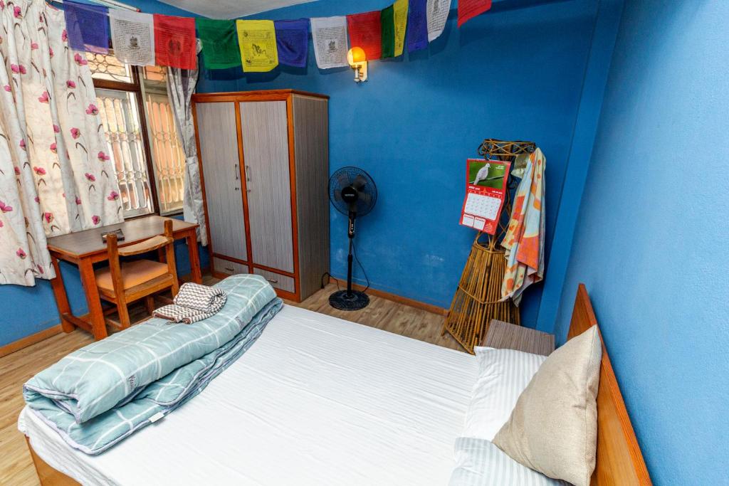 Voodi või voodid majutusasutuse Shekhar's Shared Home toas