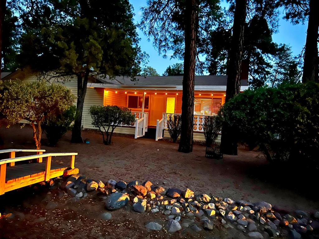 a house with a fire pit in front of it at Hidden Gem Retreat in the Heart of Payson in Payson