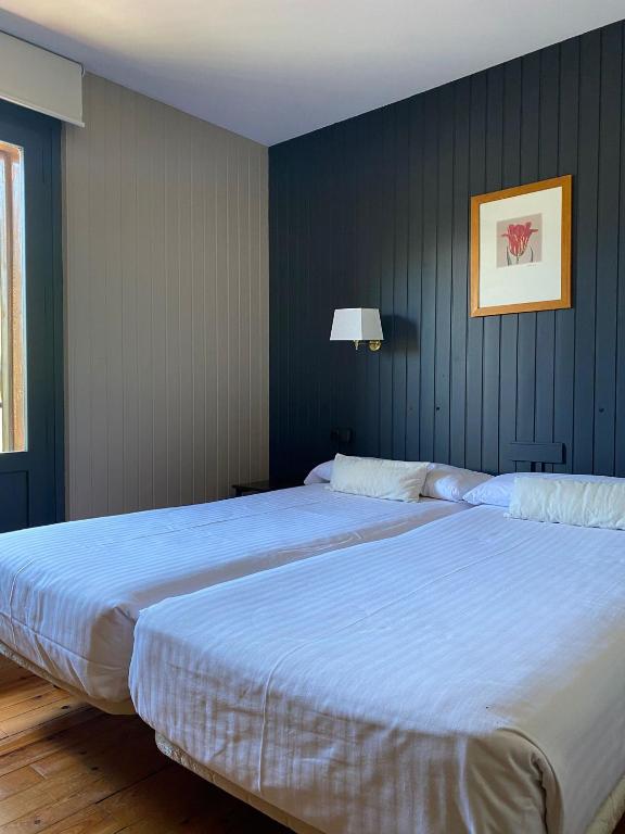 Postel nebo postele na pokoji v ubytování Hotel Tobazo