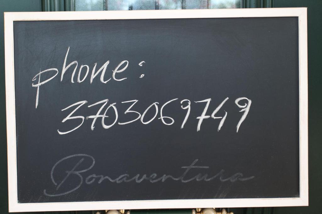 a chalkboard sign with the words phone at B&B Bonaventura and Bonaventura Food in Tollo